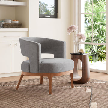 charcoal textured accent chair in a farmhouse contemporary bedroom setting