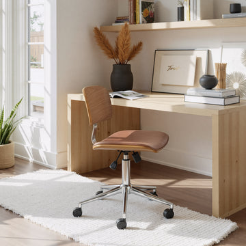 charcoal textured accent chair in a minimalist dining room setting