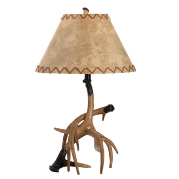 neutral-toned linen table lamp in a transitional living room setting