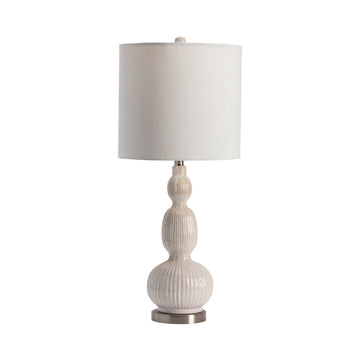 neutral-toned linen table lamp in a refined master bedroom setting