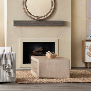 earth-toned fabric accent table in a refined master bedroom setting