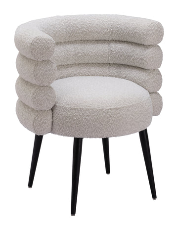 neutral linen accent chair styled in a coastal elegant dining room