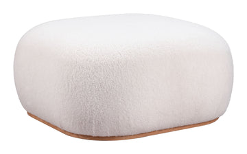 cream brushed metal ottoman styled in a contemporary minimalist entryway