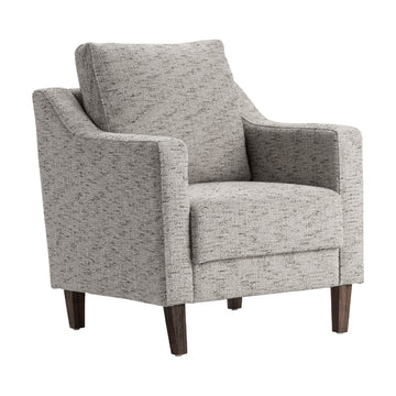 earth-toned fabric accent chair in a coastal guest room setting