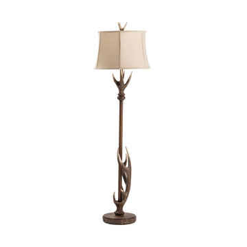 earth-toned fabric table lamp in a classic entryway setting