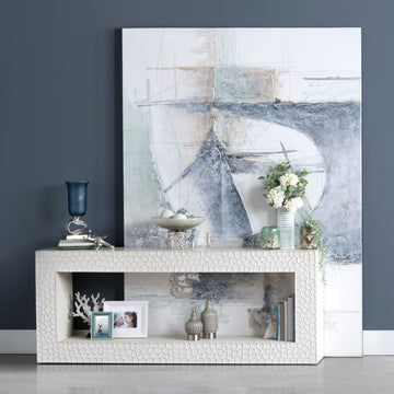 warm-toned soft accent table in a coastal guest room setting