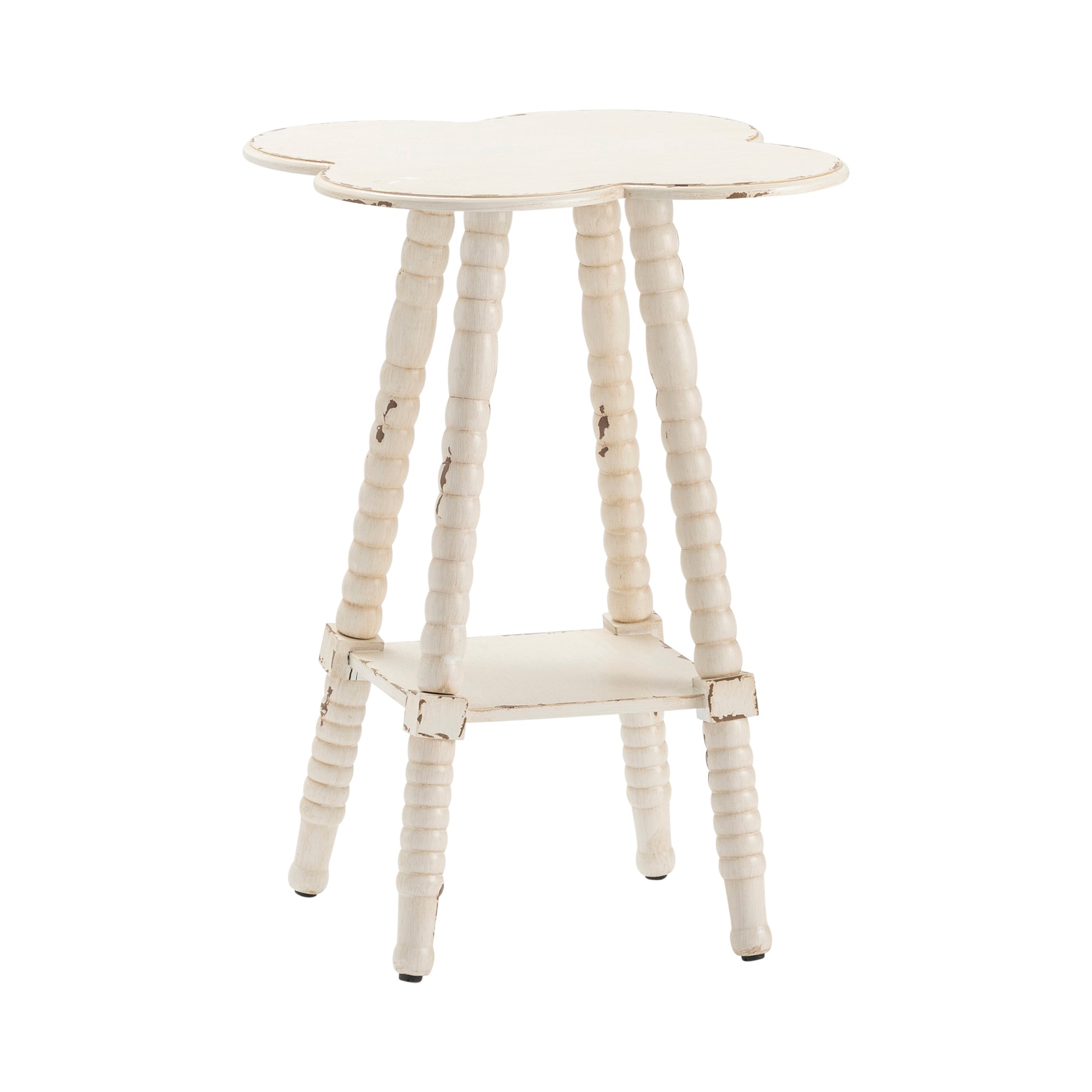 neutral-toned linen accent table in a coastal guest room setting