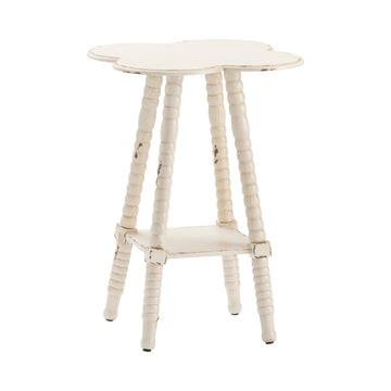 neutral-toned linen accent table in a coastal guest room setting