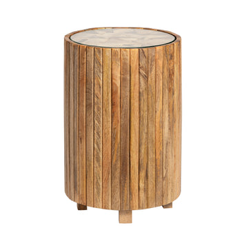 earth-toned fabric accent table in a coastal guest room setting