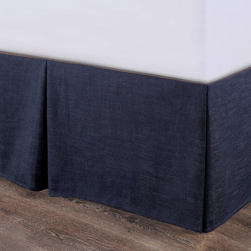 matte black linen bed frame styled in a coastal elegant dining room
