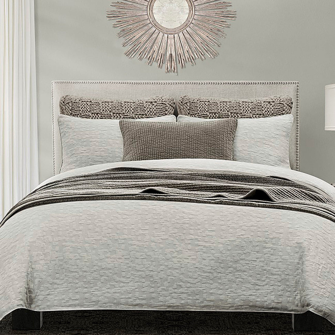 soft gray solid wood comforter set styled in a modern modern living room