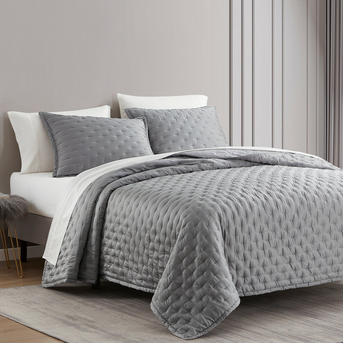 gray cotton quilt in a elegant modern bedroom setting