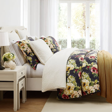ivory soft comforter set in a minimalist guest room setting