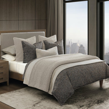 natural fabric comforter set in a minimalist guest room setting