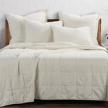 warm-toned plush home décor piece in a elegant modern bedroom setting