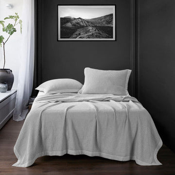 cream woven home décor piece in a modern bedroom setting