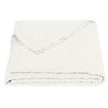 white brushed quilt in a contemporary master bedroom setting
