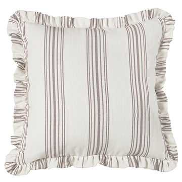 cream woven pillow sham in a minimalist guest room setting