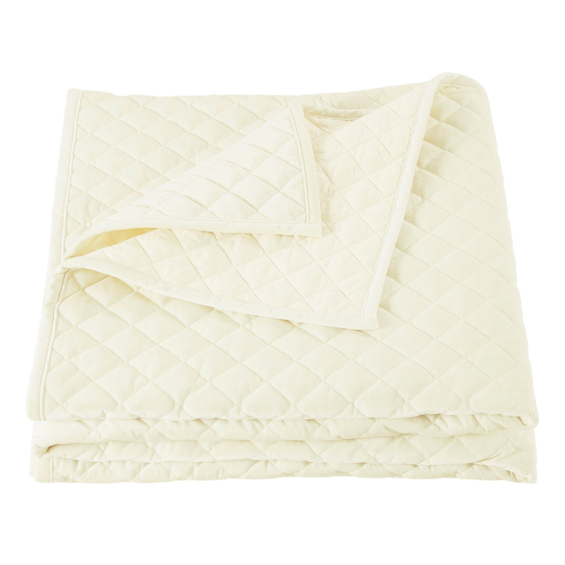 ivory soft quilt in a minimalist guest room setting