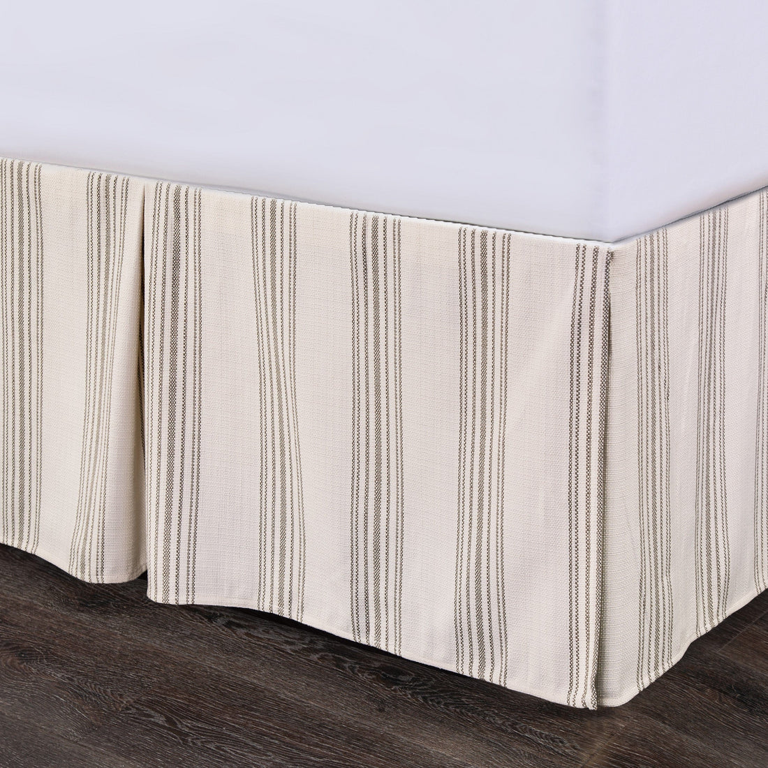earth-toned textured bed skirt in a modern bedroom setting