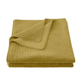 neutral-toned linen quilt in a classic contemporary bedroom setting
