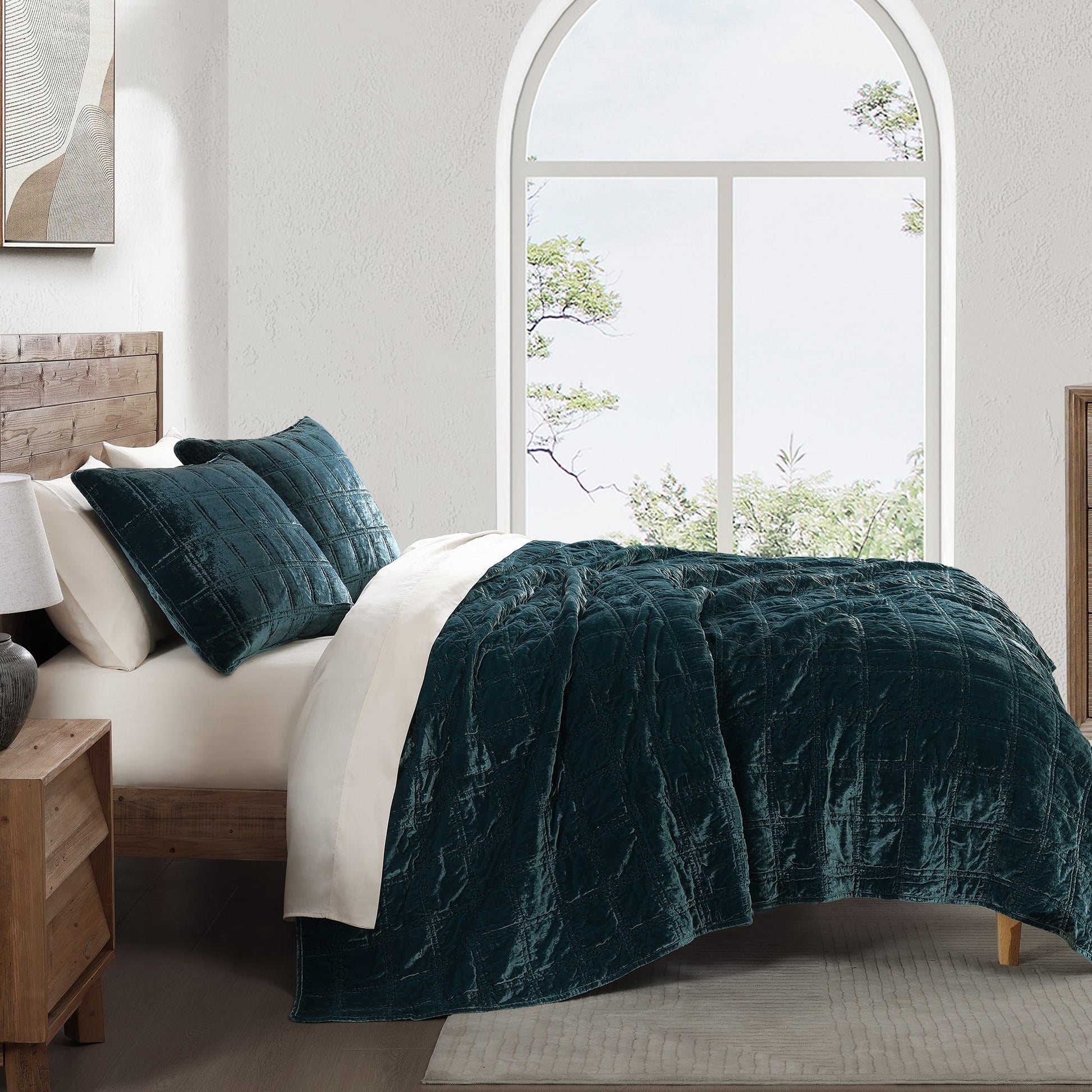 gray cotton quilt in a minimalist guest room setting