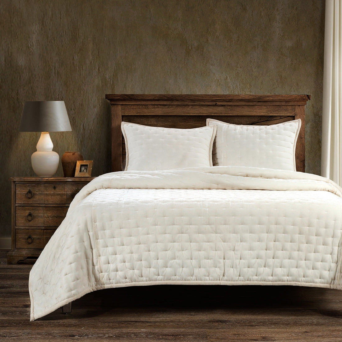 earth-toned textured quilt in a farmhouse cozy bedroom setting