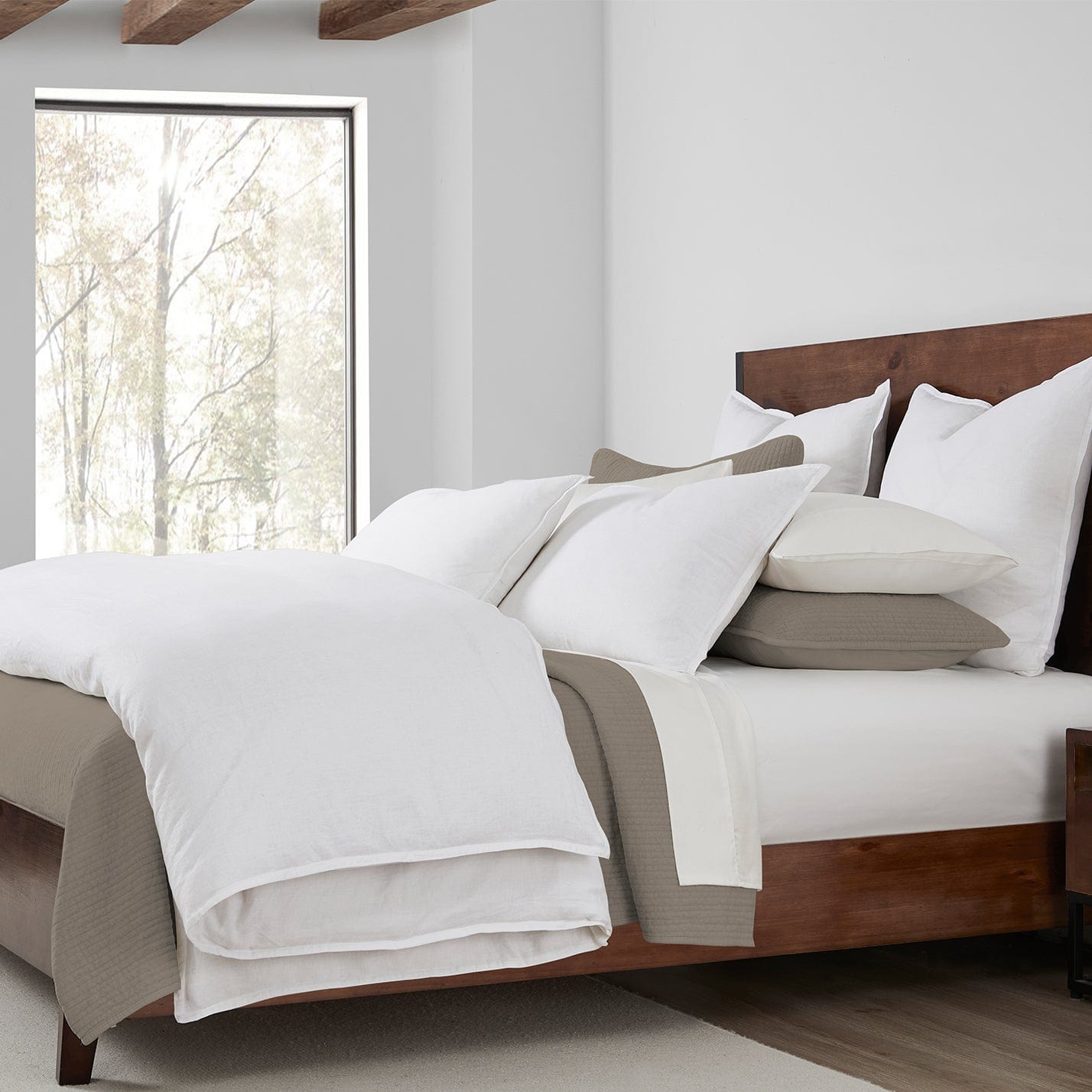 neutral-toned linen duvet cover in a minimalist guest room setting