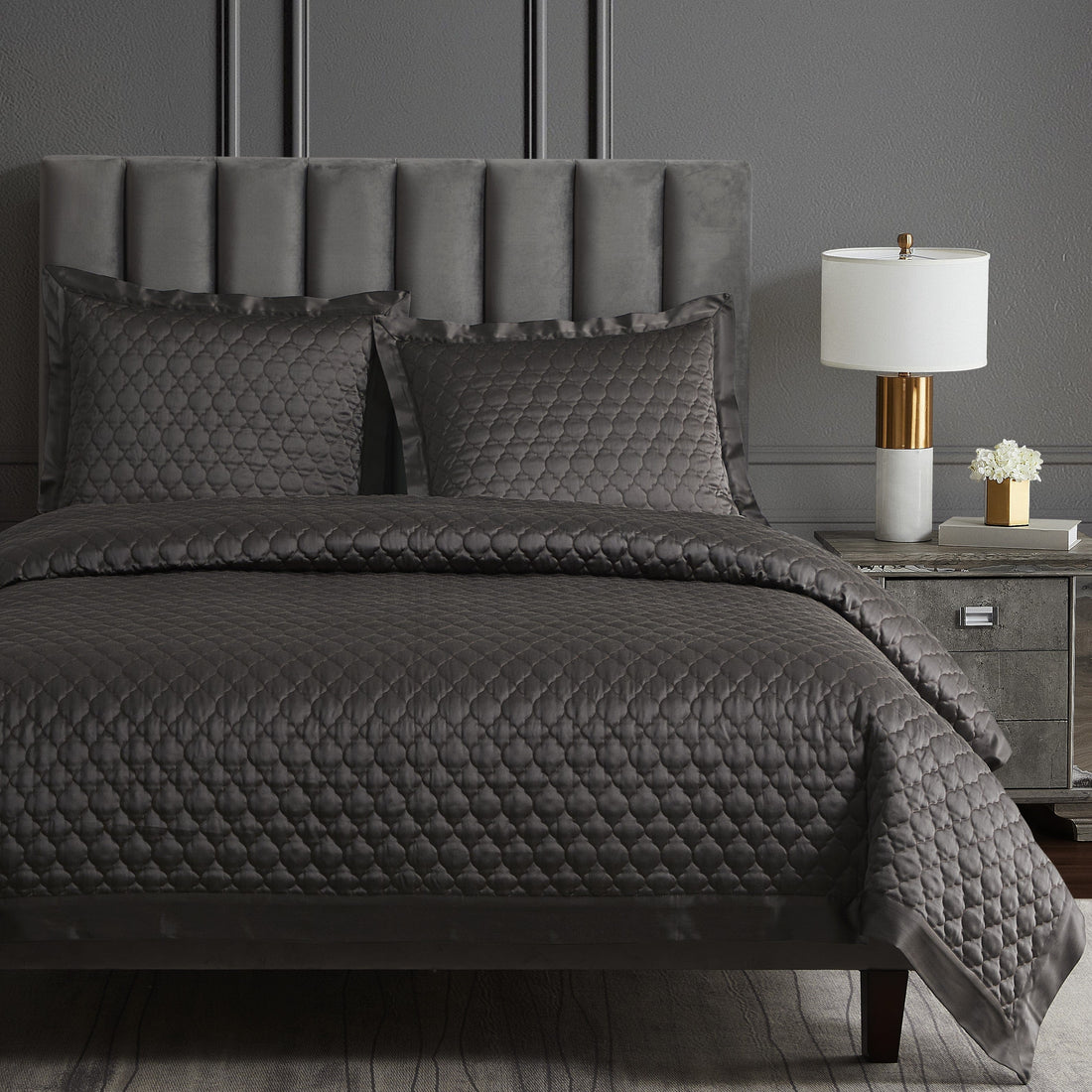 gray cotton quilt in a contemporary master bedroom setting