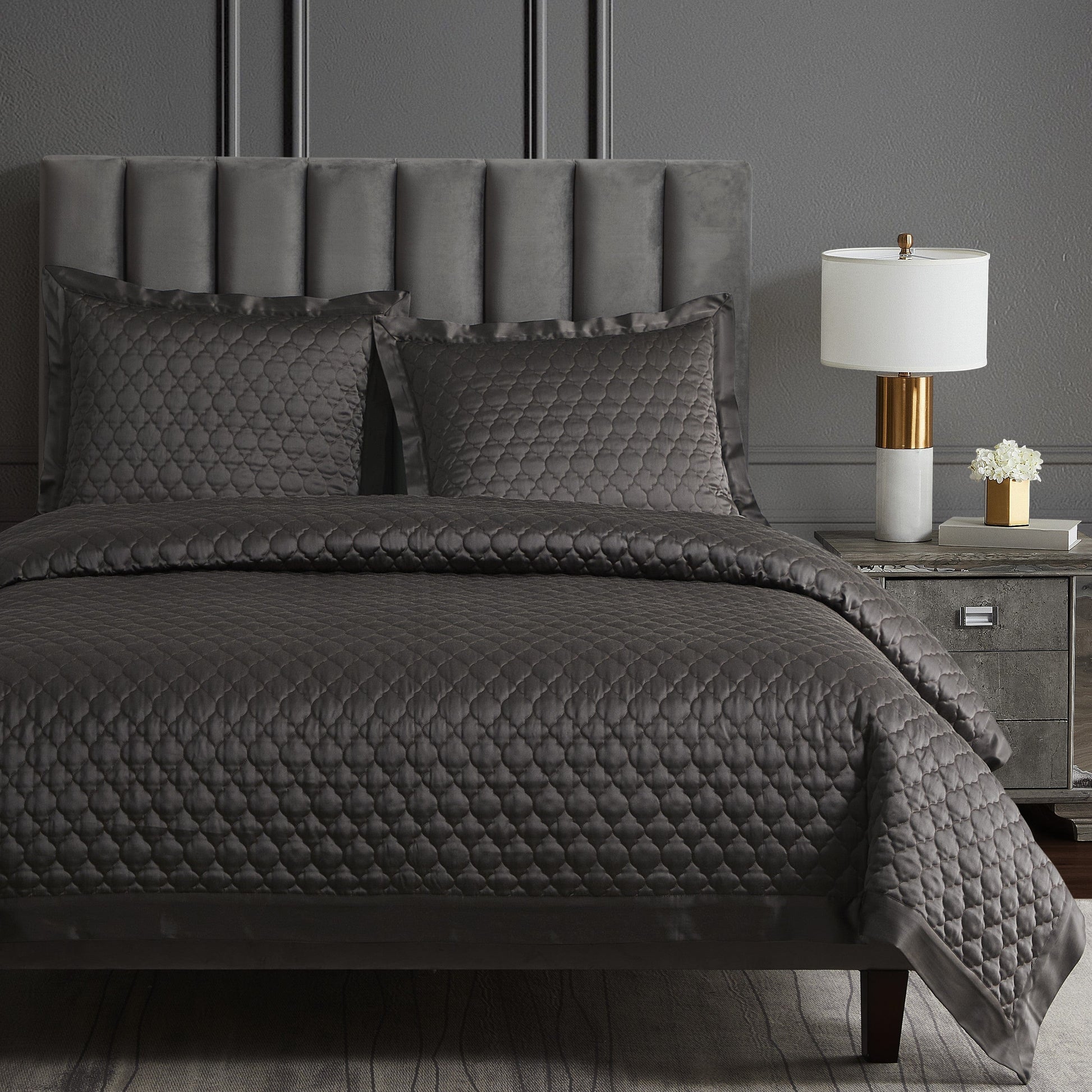 gray cotton quilt in a contemporary master bedroom setting
