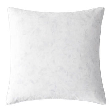 white brushed home décor piece in a minimalist guest room setting