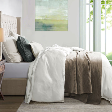 earth-toned fabric duvet cover in a minimalist dining room setting