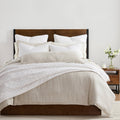 gray canvas quilt in a farmhouse contemporary bedroom setting