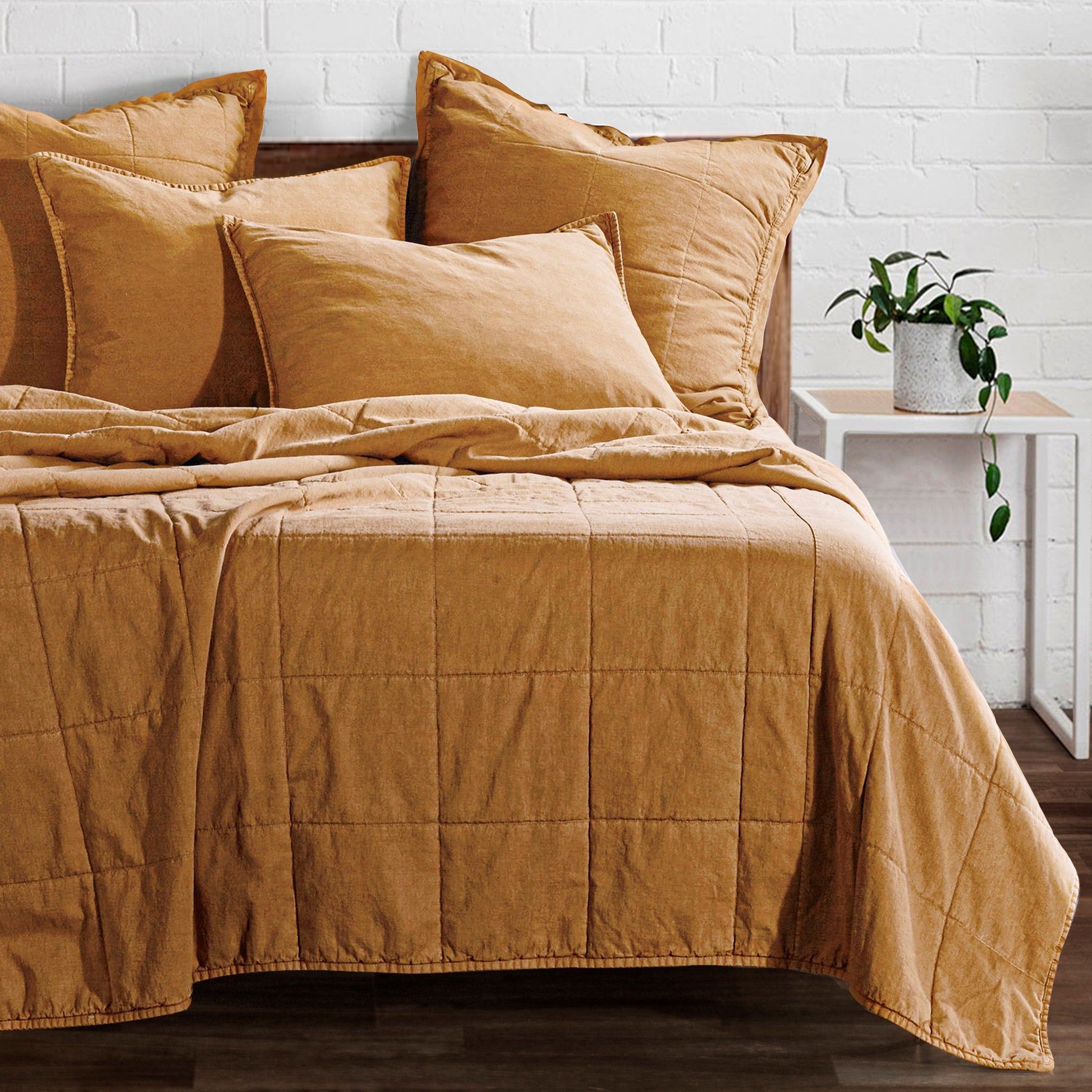 white brushed home décor piece in a coastal guest room setting