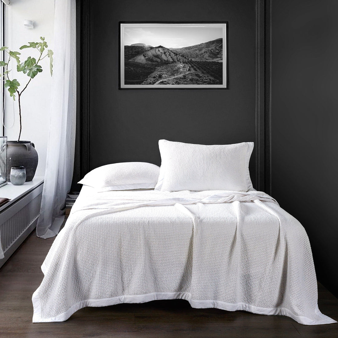 charcoal textured home décor piece in a minimalist dining room setting