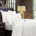 charcoal textured quilt in a transitional living room setting