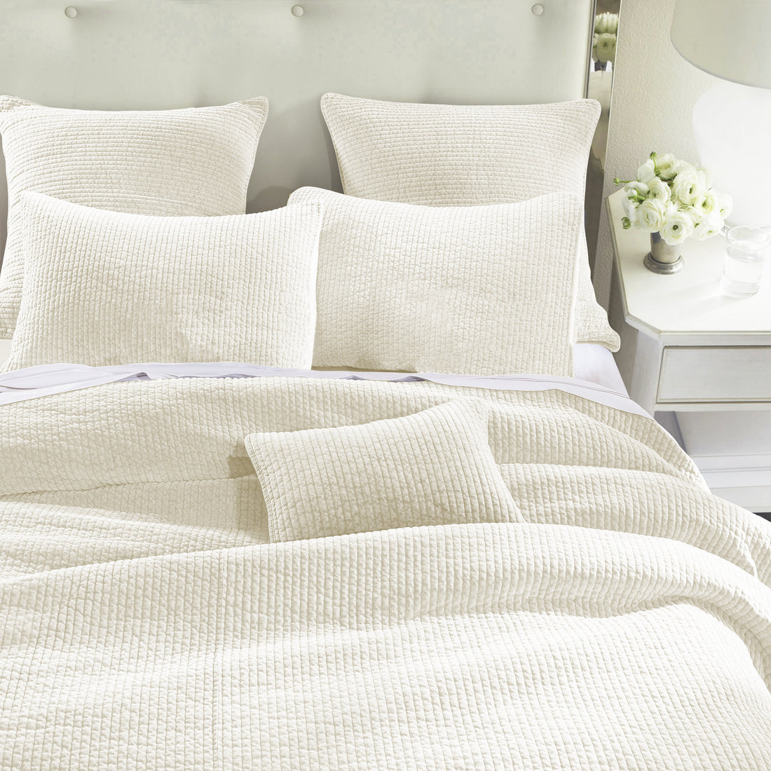 beige plush quilt in a classic entryway setting