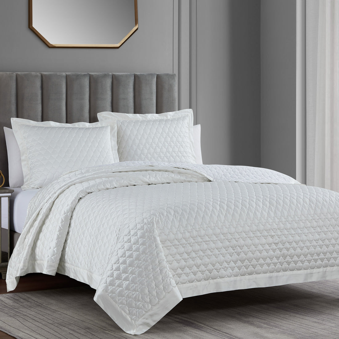 neutral-toned linen quilt in a transitional living room setting