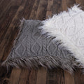 Nordic Cable Knit & Mongolian Fur Throw Pillow styled for a transitional living room space.