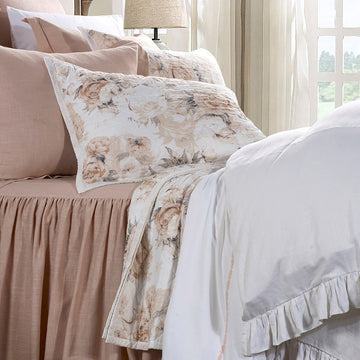 neutral-toned linen quilt in a classic entryway setting