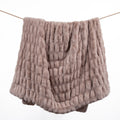 Textured brown blanket on a white background