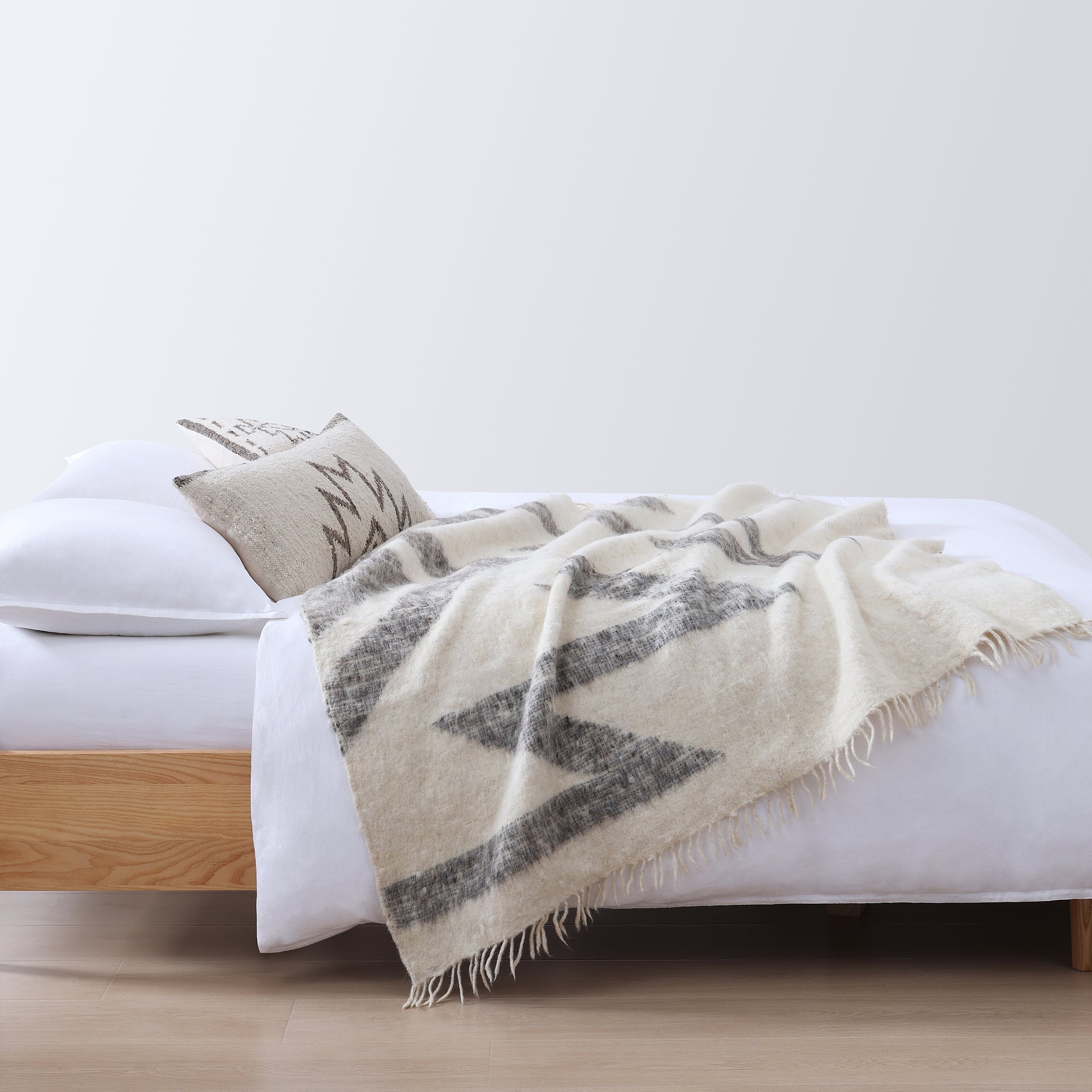 Maguey 100% Wool Handwoven Throw Blanket styled for a transitional living room space.