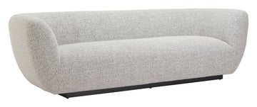 earth-toned marble sofa styled in a transitional serene master suite
