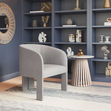 gray canvas accent chair in a contemporary cozy bedroom setting
