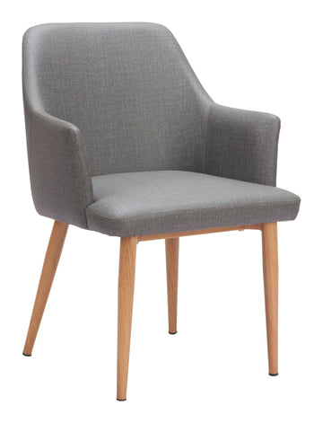 warm-toned brushed metal accent chair styled in a contemporary minimalist entryway
