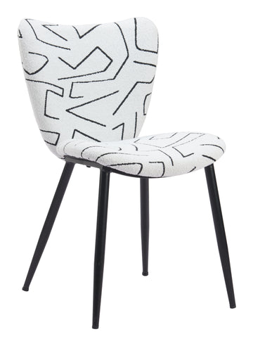neutral linen accent chair styled in a coastal elegant dining room