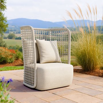 earth-toned fabric accent chair in a elegant modern bedroom setting