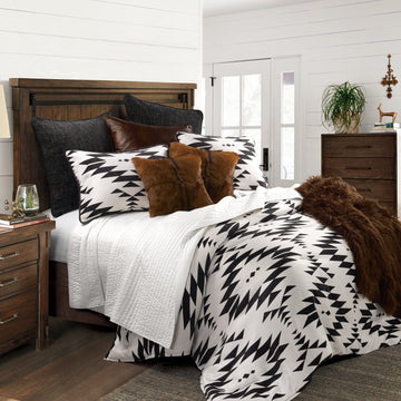 matte black linen comforter set styled in a coastal elegant dining room