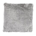warm-toned brushed metal pillow sham styled in a contemporary minimalist entryway