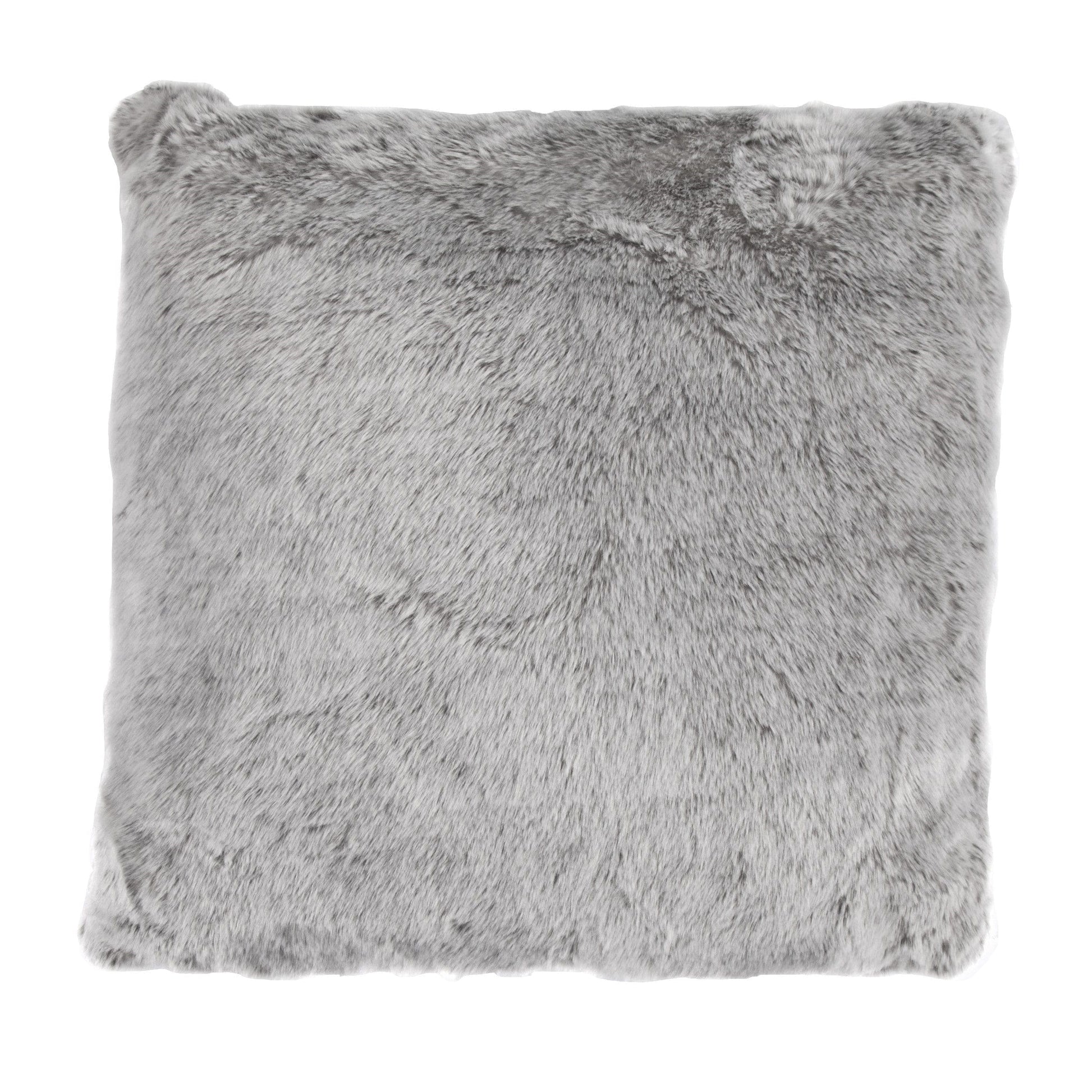 warm-toned brushed metal pillow sham styled in a contemporary minimalist entryway